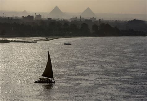   “The Nile and its Bounty” - An Exquisite Study in Light and Human Connection!